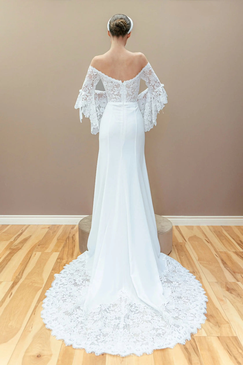 white off-the-shoulder wedding dress