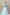 Aqua couture wedding gown with embroidered illusion bodice, layered tulle skirt, and cathedral veil.