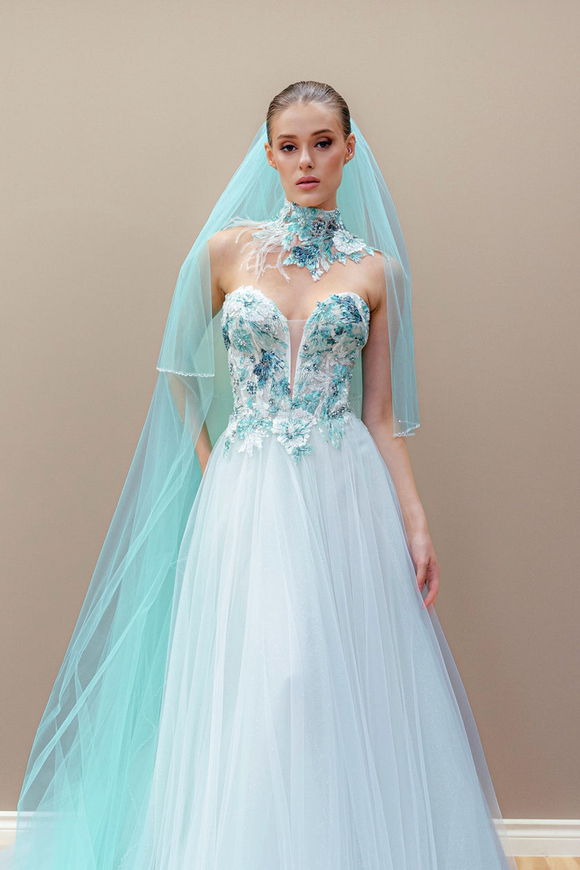 Aqua couture wedding gown with embroidered illusion bodice, layered tulle skirt, and cathedral veil.