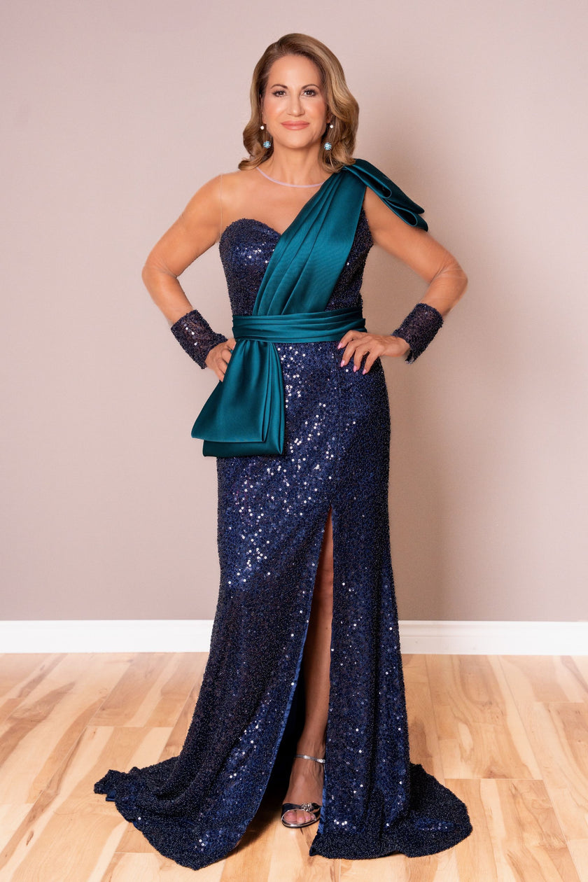 Navy and emerald mother of the bride dress with sequin bodice and satin drape.
