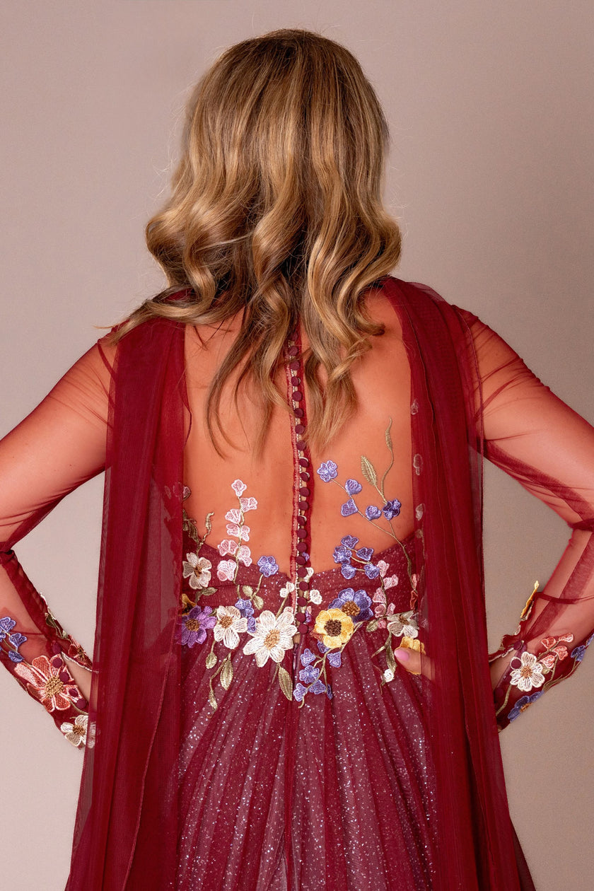 Back view of the burgundy mother of the bride gown, showcasing the A-line skirt and delicate keyhole detailing.