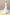Modern lace wedding gown with a halter neckline and detachable tulle overskirt.