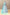Aqua embroidered illusion wedding gown with a voluminous layered tulle skirt and matching veil.