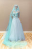 Aqua embroidered illusion wedding gown with a voluminous layered tulle skirt and matching veil.