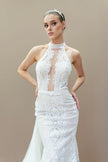 Sleek, fitted silhouette of the modern lace halter wedding gown for the reception.