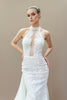 Sleek, fitted silhouette of the modern lace halter wedding gown for the reception.