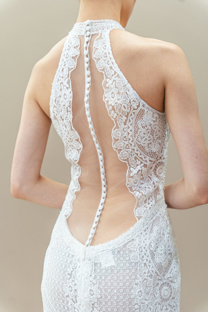 Back view of the modern lace halter neck wedding dress.