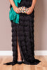 Black fringe evening gown, showcasing the elegant floor-length silhouette.