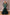 Front view of emerald green sequin mermaid gown with deep V illusion neckline