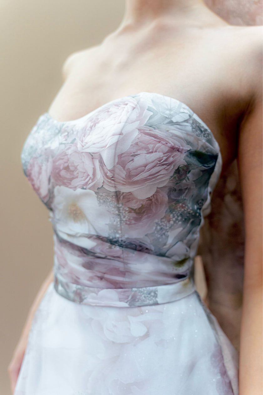 Close-up of the soft, draped strapless bodice on the couture bridal gown.