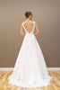 Back view of the modern A-line wedding gown, showcasing the elegant silhouette and luxurious fabric.