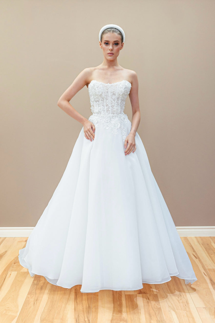Romantic couture wedding gown with a strapless Swarovski crystal corset and a voluminous A-line organza skirt.