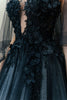 Close-up of the intricate hand-embroidery on the black illusion bodice of the couture wedding gown.