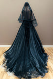 Back view of the embroidered black wedding gown, showcasing the silhouette and long cathedral veil.
