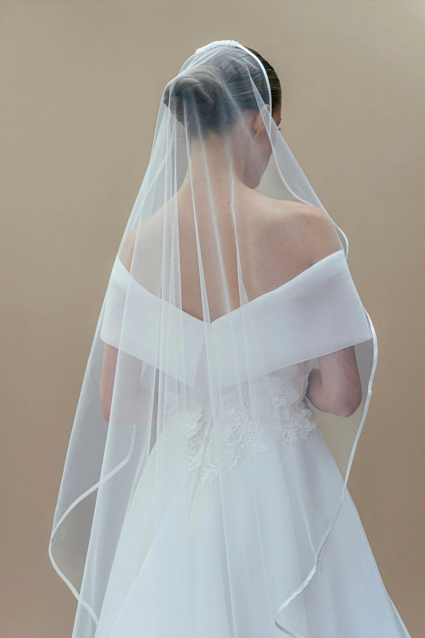 white off-the-shoulder wedding dress