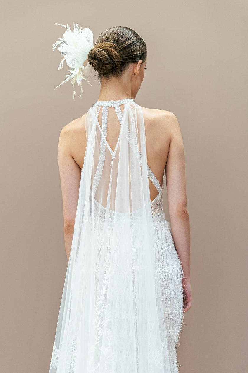 Elegant low back of the modern couture halter neck wedding gown.