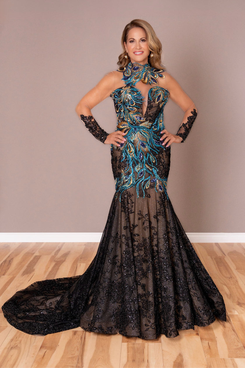 Black lace mother-of-the-bride gown with jewel-toned embroidery and blue feather details.