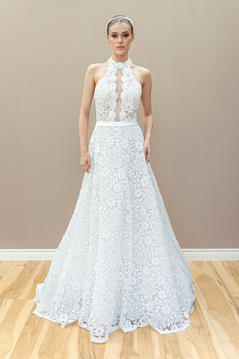 Floral lace halter wedding gown with illusion bodice and timeless A-line skirt.