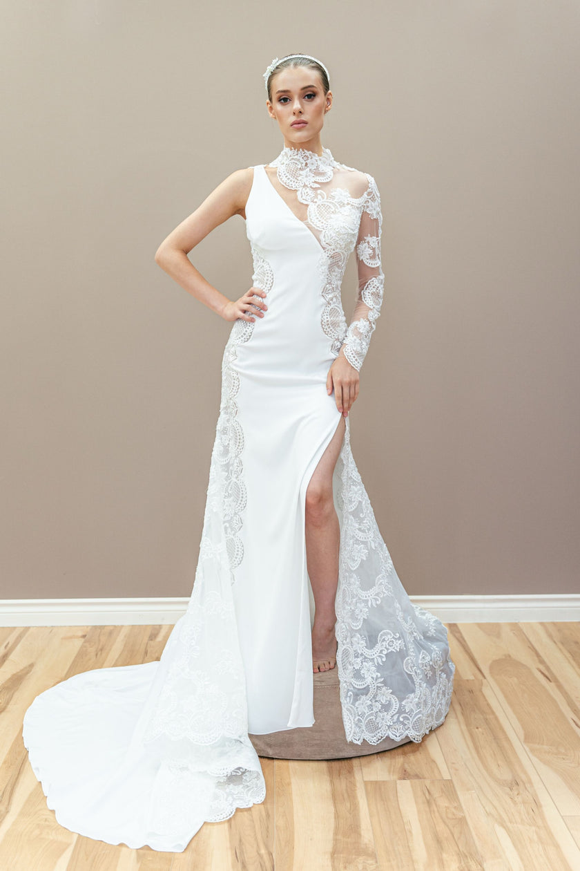 Unique couture wedding gown with a one-shoulder lace design and a high side slit.