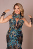 Detail of the blue feather accents on the jewel-toned embroidered black lace gown.